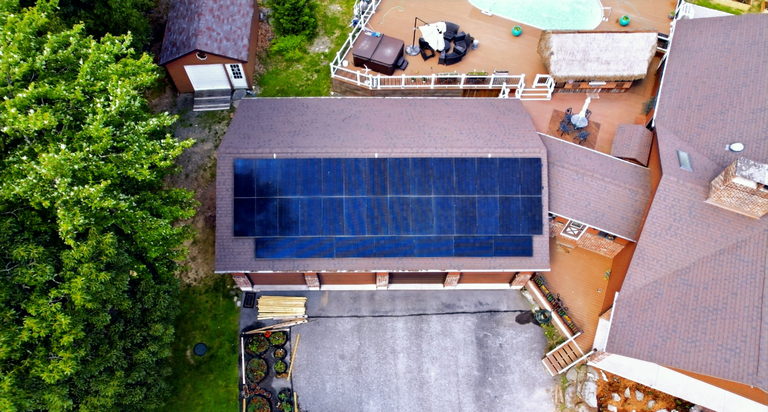 A flat roof covered in solar panels